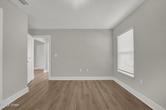 8470 Sun Point Dr, Panama City, FL 32404 - empty room with wood finished floors
