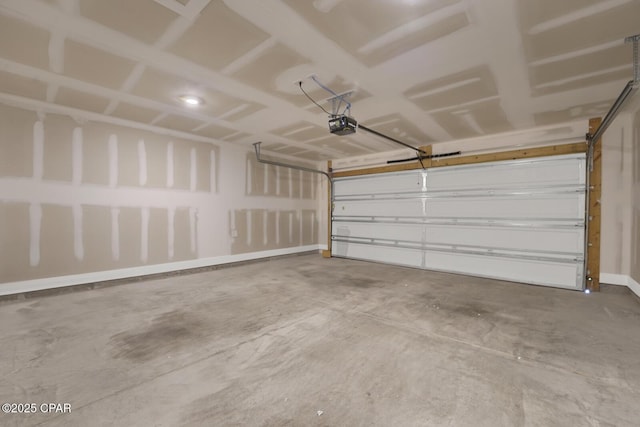 8470 Sun Point Dr, Panama City, FL 32404 - garage featuring a garage door opener and baseboards