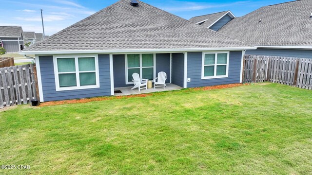 8470 Sun Point Dr, Panama City, FL 32404 - rear view of house with roof with shingles, a fenced backyard, and a patio area