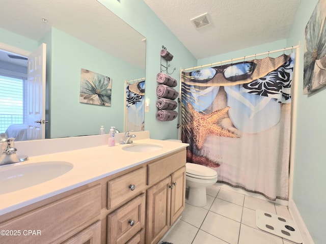 full bathroom with a sink, visible vents, a textured ceiling, and tile patterned flooring