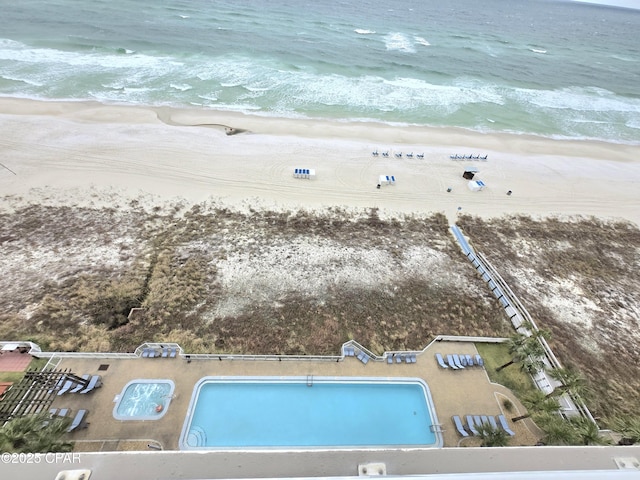 aerial view featuring a water view and a beach view