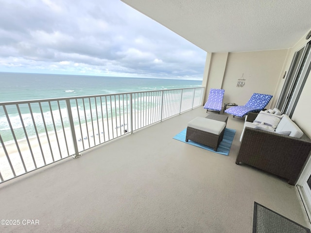 balcony with a view of the beach and a water view