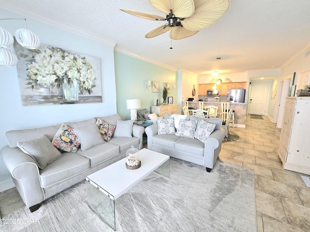 living room with crown molding and a ceiling fan