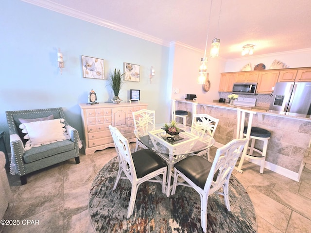 dining space with ornamental molding