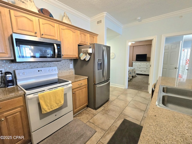 kitchen featuring visible vents, appliances with stainless steel finishes, ornamental molding, and decorative backsplash