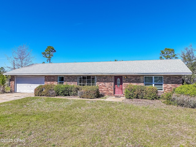 single story home with brick siding, a garage, a front yard, and driveway