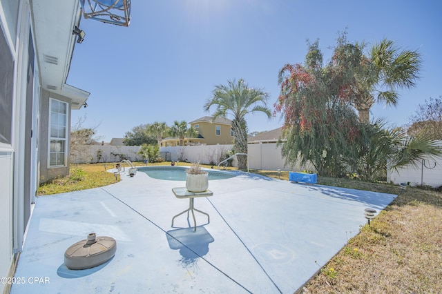 view of pool featuring a patio area, a fenced in pool, and a fenced backyard