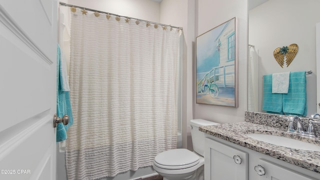 full bathroom featuring shower / tub combo with curtain, toilet, and vanity
