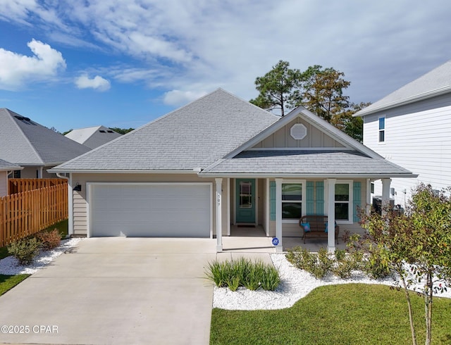 single story home featuring concrete driveway, board and batten siding, an attached garage, fence, and a porch