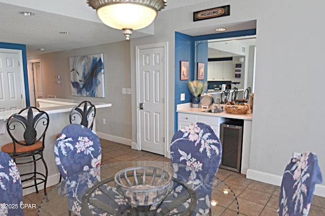 10811 Front Bch Unit 501, Panama City Beach, FL 32407 - dining area with wine cooler, tile patterned floors, wet bar, and recessed lighting