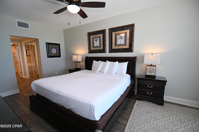 10811 Front Bch Unit 501, Panama City Beach, FL 32407 - bedroom with wood finished floors, ensuite bath, and a ceiling fan