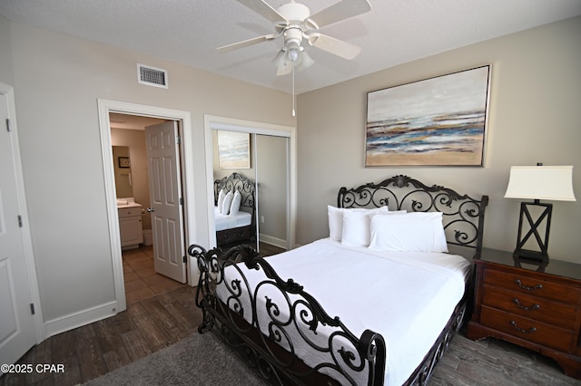 10811 Front Bch Unit 501, Panama City Beach, FL 32407 - bedroom featuring a closet, dark wood finished floors, and a ceiling fan
