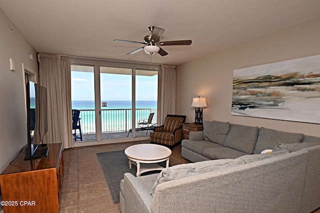 10811 Front Bch Unit 501, Panama City Beach, FL 32407 - living area featuring ceiling fan