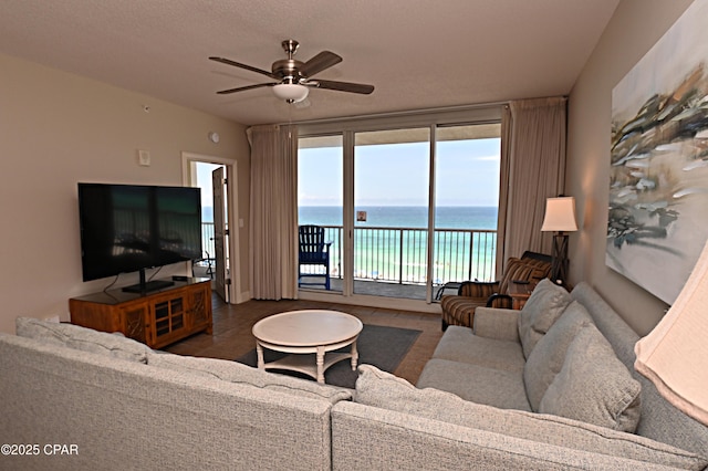 10811 Front Bch Unit 501, Panama City Beach, FL 32407 - living room with a ceiling fan