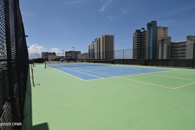 10811 Front Bch Unit 501, Panama City Beach, FL 32407 - view of tennis court featuring a view of city and community basketball court