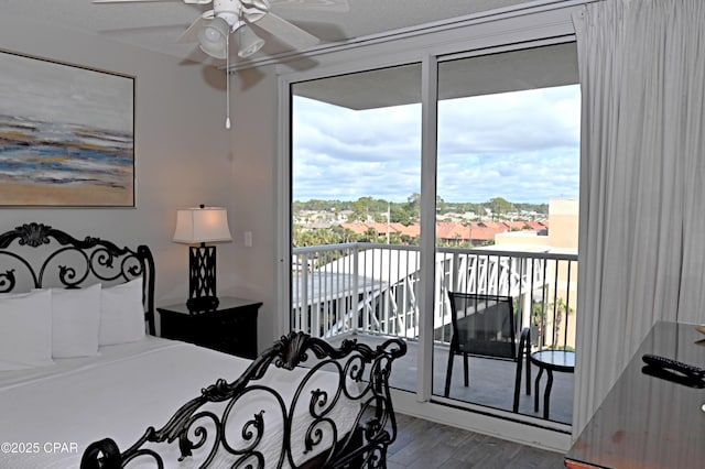 10811 Front Bch Unit 501, Panama City Beach, FL 32407 - bedroom with access to outside and wood finished floors