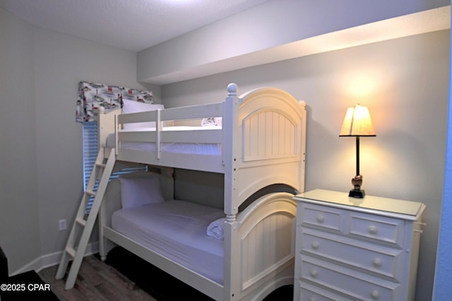 10811 Front Bch Unit 501, Panama City Beach, FL 32407 - bedroom featuring dark wood-style floors and baseboards