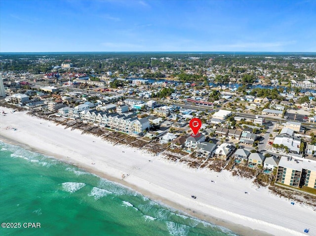 birds eye view of property featuring a view of the beach and a water view