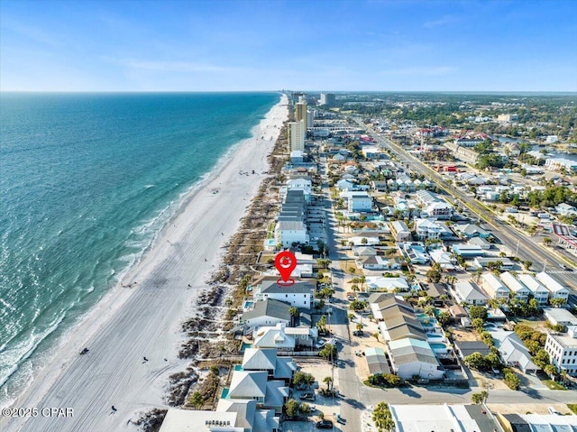 aerial view with a water view and a view of the beach