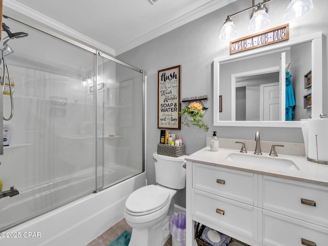 full bathroom featuring vanity, crown molding, toilet, and shower / bath combination with glass door