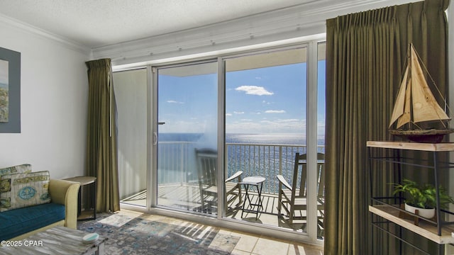9450 S Thomas Unit 2106D, Panama City, FL 32408 - living area with a water view, crown molding, healthy amount of natural light, tile patterned floors, and a textured ceiling