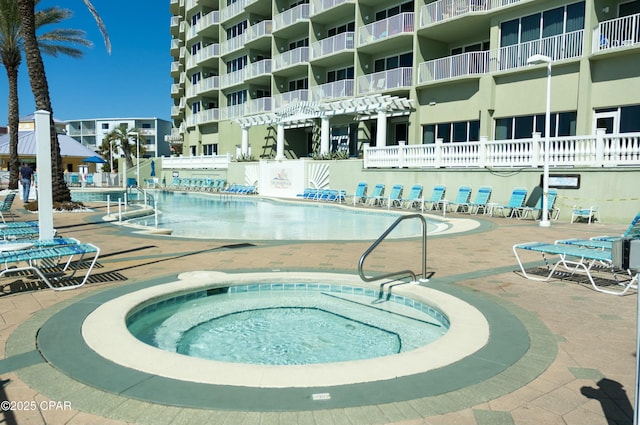 9450 S Thomas Unit 2106D, Panama City, FL 32408 - community pool featuring a patio area and a community hot tub