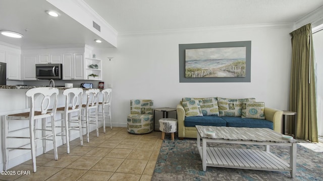9450 S Thomas Unit 2106D, Panama City, FL 32408 - living area featuring ornamental molding, light tile patterned flooring, and recessed lighting