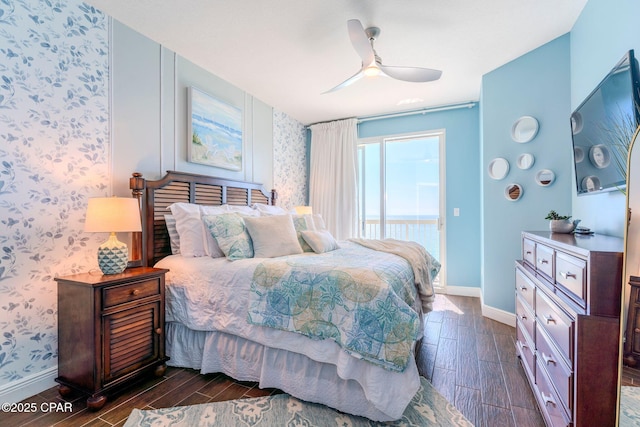 bedroom featuring baseboards, ceiling fan, wallpapered walls, and wood finish floors