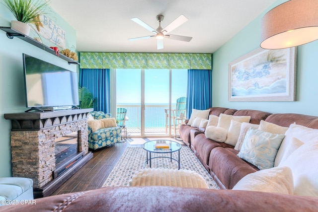 living area featuring a ceiling fan and wood finished floors