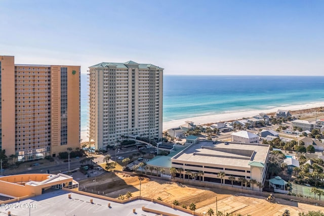 aerial view with a city view, a beach view, and a water view