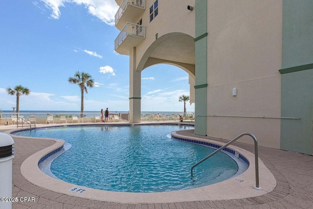 community pool with a patio