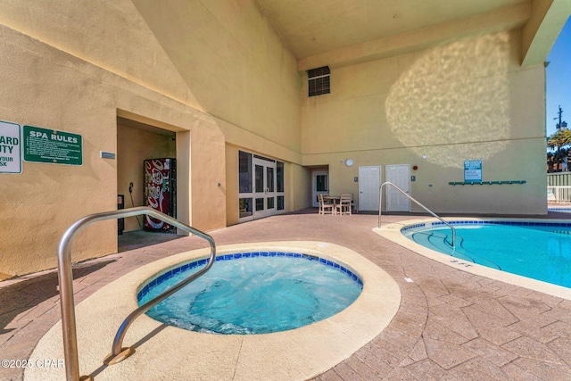 pool featuring a patio area