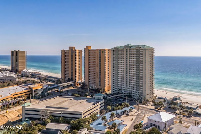 bird's eye view featuring a view of the beach and a water view