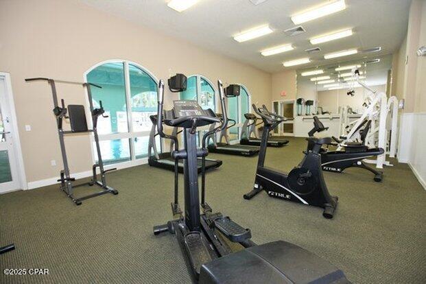 workout area featuring baseboards