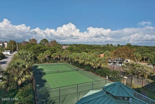 view of tennis court with fence