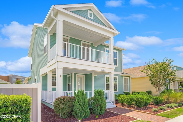 view of front of property with a balcony and a porch