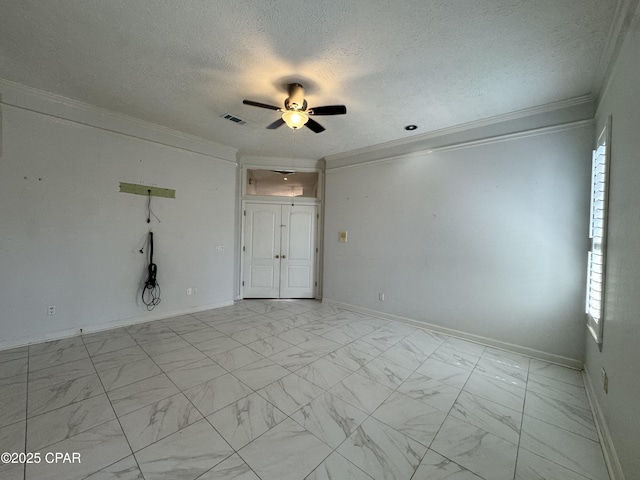 unfurnished room with visible vents, a textured ceiling, marble finish floor, and crown molding