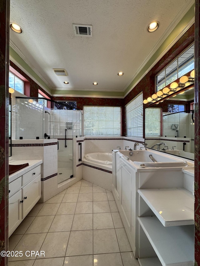 bathroom featuring vanity, a stall shower, visible vents, and a textured ceiling