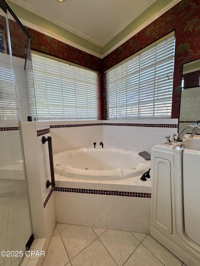 bathroom with tile patterned flooring, a shower stall, ornamental molding, a bath, and vanity