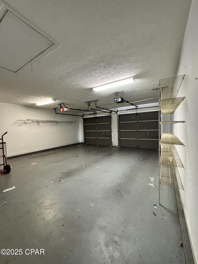 garage featuring a garage door opener