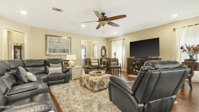 living area with visible vents, recessed lighting, ceiling fan, and wood finished floors