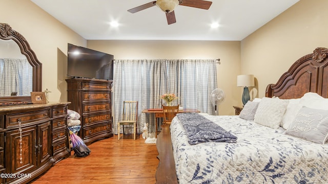 bedroom featuring light wood-type flooring and ceiling fan