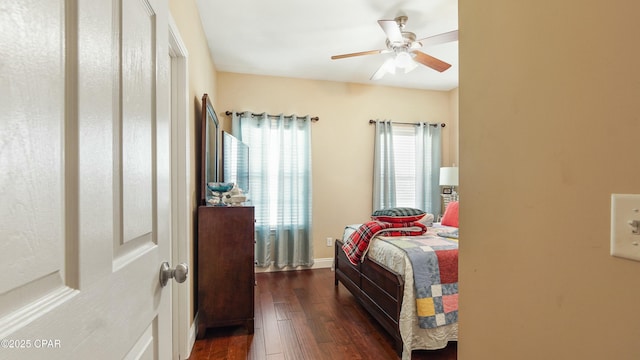 bedroom featuring dark wood finished floors and a ceiling fan