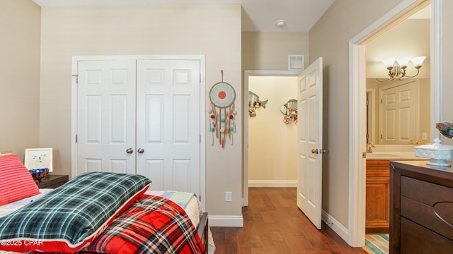 bedroom with a closet, visible vents, baseboards, and dark wood-style flooring