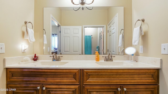 full bath with double vanity and a sink