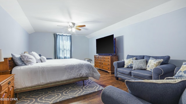 bedroom featuring vaulted ceiling, wood finished floors, and ceiling fan