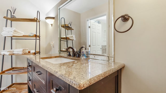 bathroom featuring vanity and baseboards