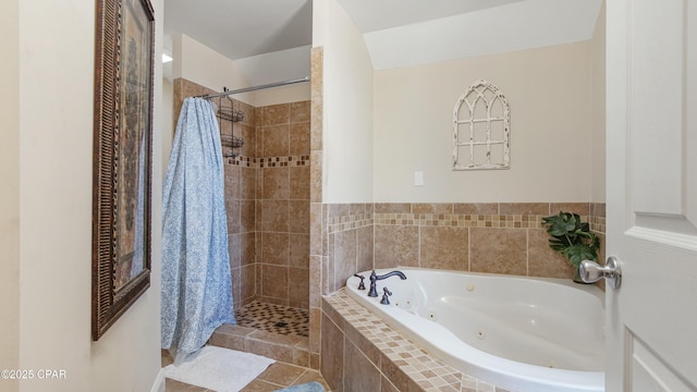 full bath with tile patterned floors, tiled shower, and a whirlpool tub