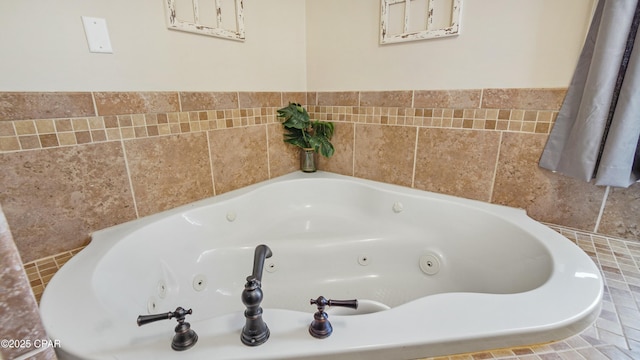 full bath featuring a tub with jets