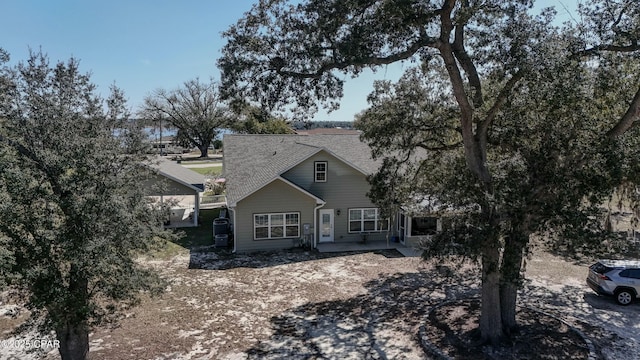 view of front of home featuring a shingled roof